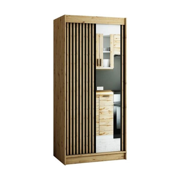De ruime en compacte kledingkast LAMELO in de kleur Artisan eiken met lamellen en een spiegel op de fronten.