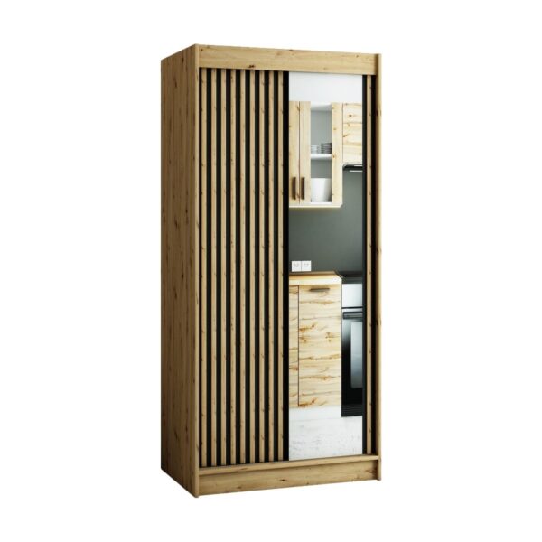 De ruime en compacte kledingkast LAMELO in de kleur Artisan eiken met lamellen en een spiegel op de fronten.