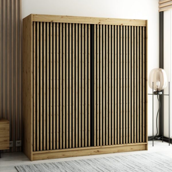 De LAMELO I kledingkast met lamellen op de fronten in loftstijl is een ruime en functionele kast in de kleur artisan eiken. Perfect voor iedereen die op zoek is naar een combinatie van modern design en praktische opbergruimte in de slaapkamer, woonkamer of hal.