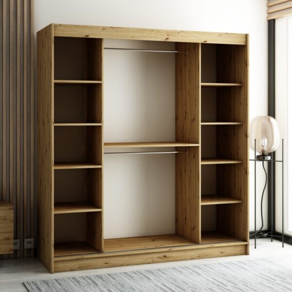 Het interieur van de LAMELO I kledingkast van 180 cm met lades, legplanken en kledingroedes voor hangers.