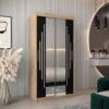 ChatGPT powiedział: Kledingkast PURMER 1 100, romp in eiken sonoma, fronten zwart met zilveren lijst en spiegel.