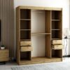 Interieur van de LAMELO II 180 kleerkast. Voorzien van legplanken, kledingroedes en lades. De kledingkast is zeer ruim en functioneel.